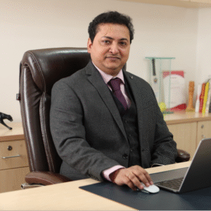 Ashish Srivastava, businessman, seated at desk, working on laptop - International Awards