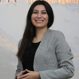 Headshot of Seda Hewitt, smiling and wearing a gray blazer. - International Awards