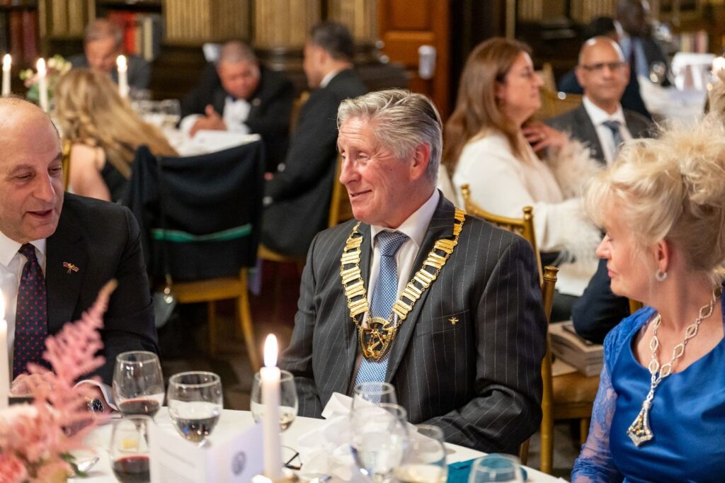 Mayor in formal wear at a gala dinner, wearing a mayoral chain of office - International Awards