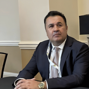 Zarean Qania Samael in a business suit at a conference. - International Awards